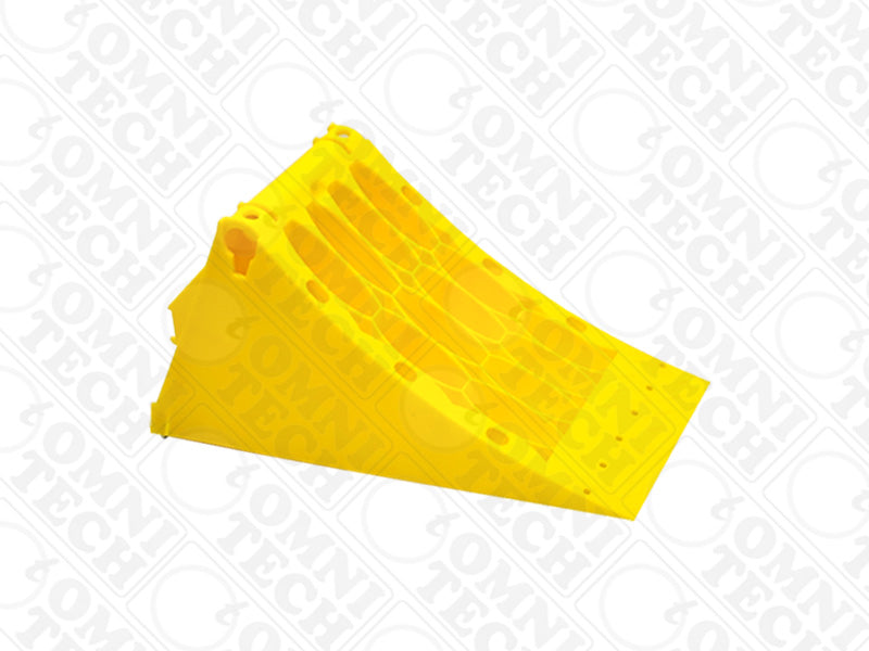 Omni Technosys Terra Chock yellow honeycomb structure HDPE wheel chock for vehicles weighing up to 20 tons side view